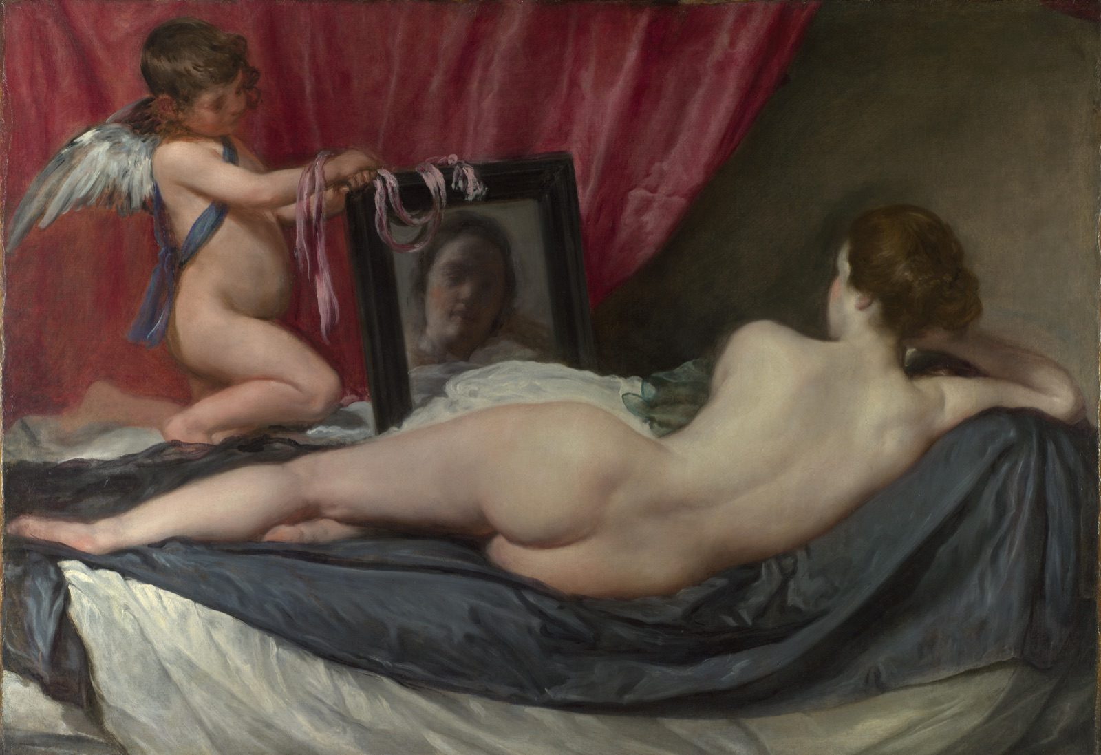 Velázquez's Rokeby Venus, showing Venus reclining with her back to the viewer while Cupid holds a mirror reflecting her face, the canvas that was slashed seven times in 1914.