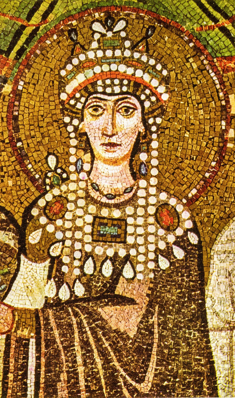 The Empress Theodora mosaic in the Basilica of San Vitale, Ravenna, showing Theodora in jeweled robes and a gemmed crown flanked by attendants and clergy, made around 547 AD.