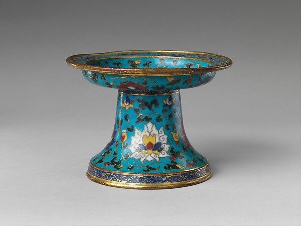 A turquoise cloisonné enamel candlestick with lotus scrolls, made in China in the late 14th or early 15th century, from the Metropolitan Museum of Art's collection.