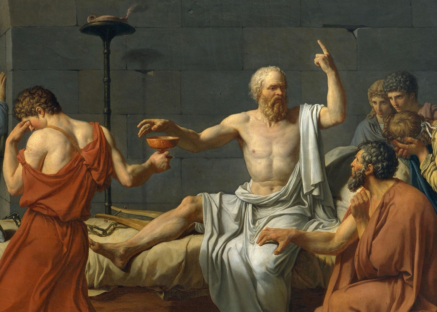 Detail of The Death of Socrates showing Socrates reaching for the cup with one hand while pointing upward with the other, and Crito gripping his thigh, the central group where most of the painting's recorded pentimenti and X-ray changes cluster.
