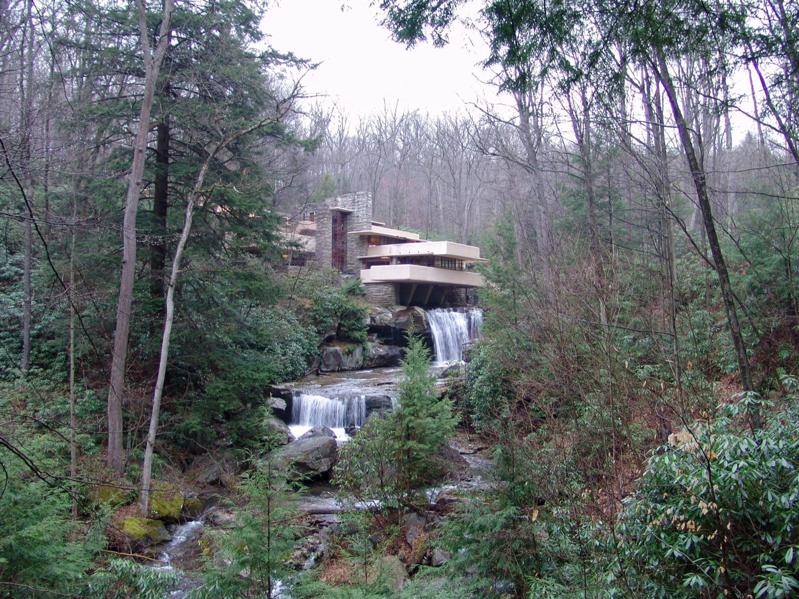 Fallingwater, Frank Lloyd Wright's 1937 house for the Kaufmann family, with its concrete terraces cantilevered directly over the waterfall on Bear Run, Pennsylvania.