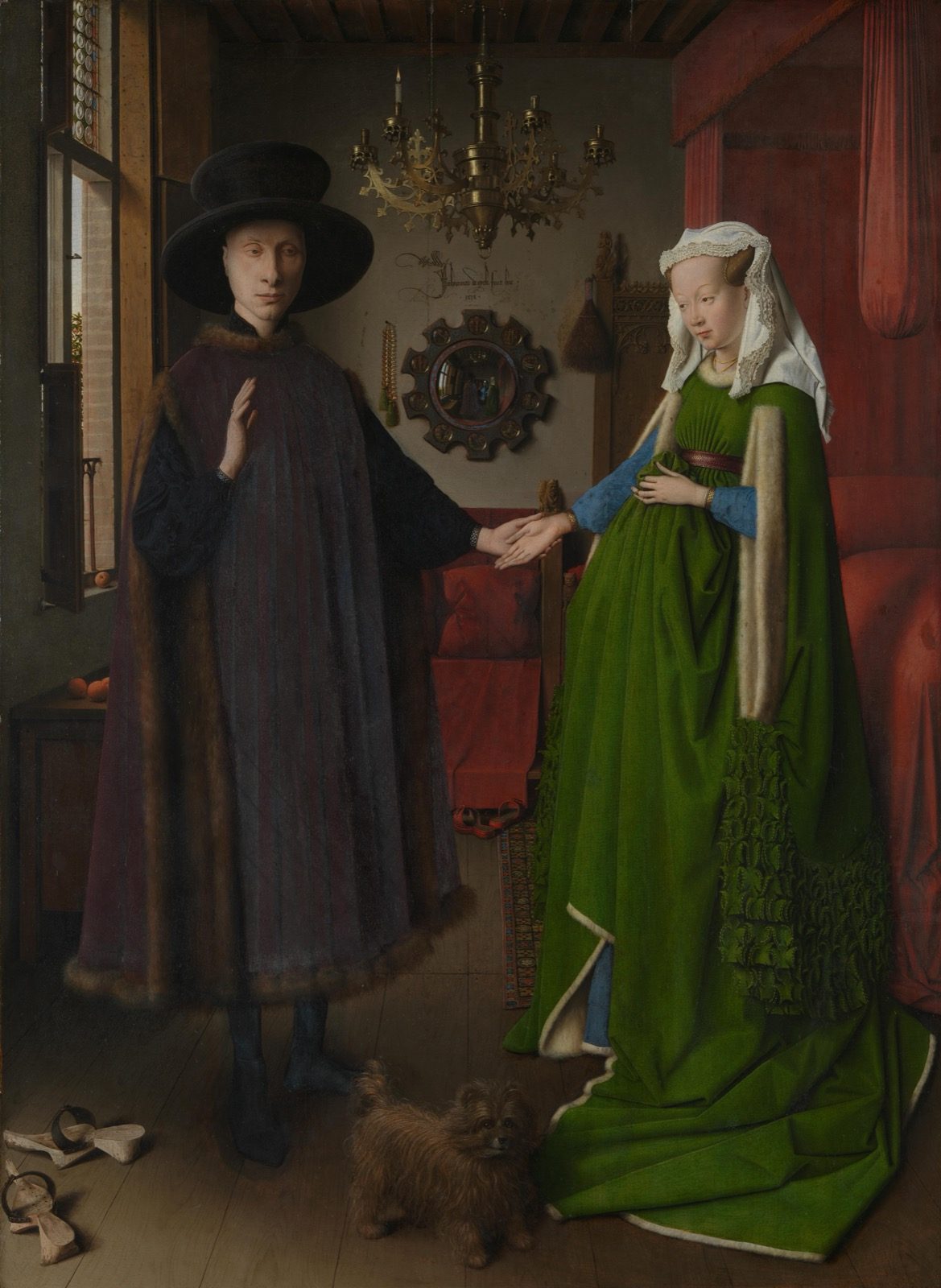Jan van Eyck's 1434 Arnolfini Portrait, showing a man and woman holding hands in a furnished chamber, with the small round mirror on the back wall that infrared reflectography found was painted without any underdrawing.