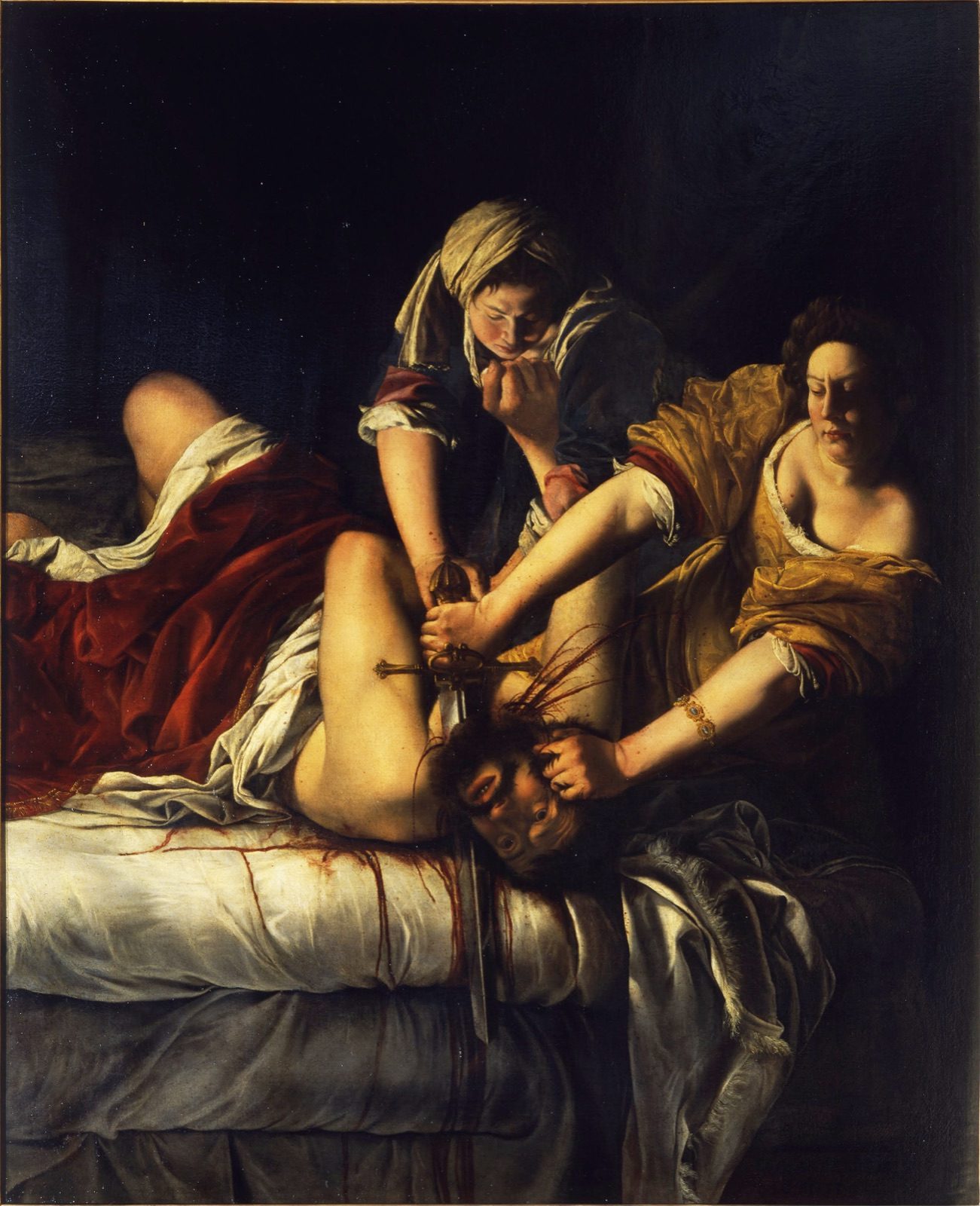 Judith Slaying Holofernes by Artemisia Gentileschi, Uffizi version, c. 1620, showing Judith and her maidservant pinning down and beheading Holofernes on his bed, blood spraying across the sheets.