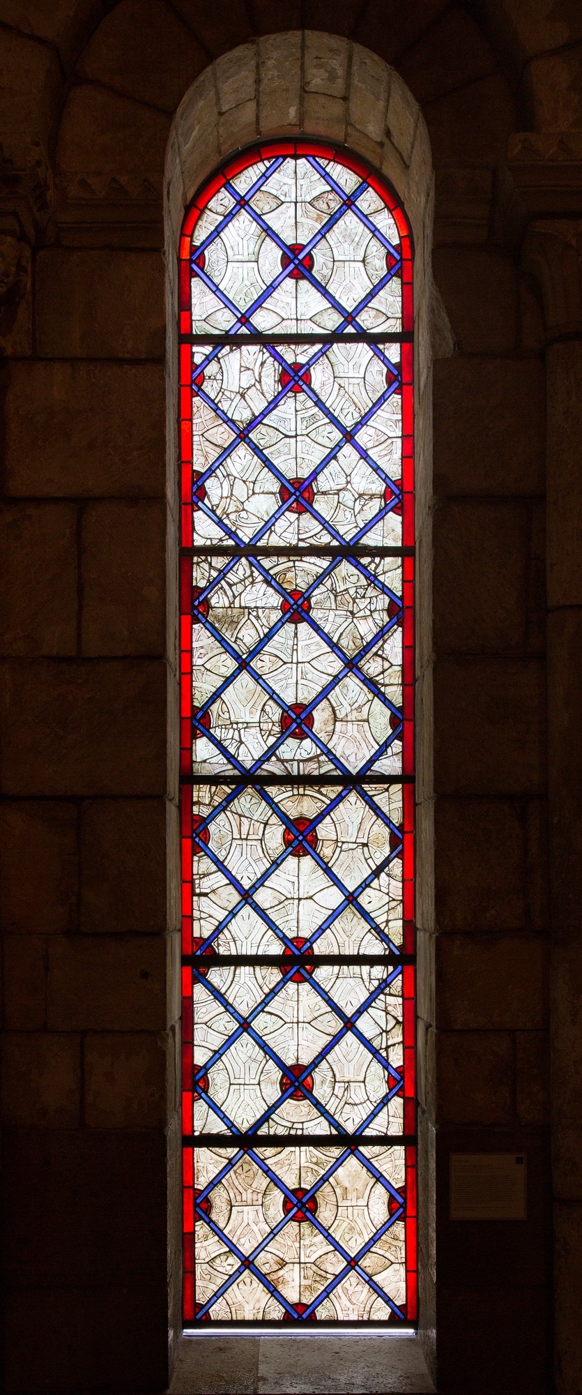 A 13th-century French grisaille stained glass panel, probably made in Normandy around 1270-80, painted in brown iron-oxide pigment on largely clear glass, from the Metropolitan Museum's Cloisters collection.
