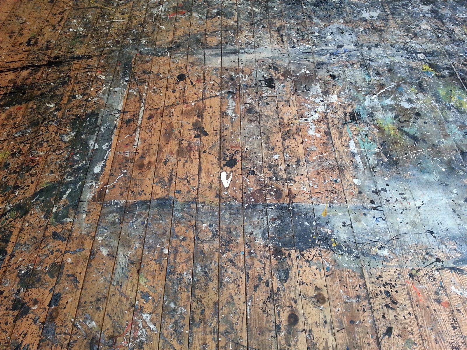 The paint-covered wood floor of Jackson Pollock's barn studio in Springs, New York, preserved and later restored by Stony Brook University after his widow Lee Krasner's death in 1984.
