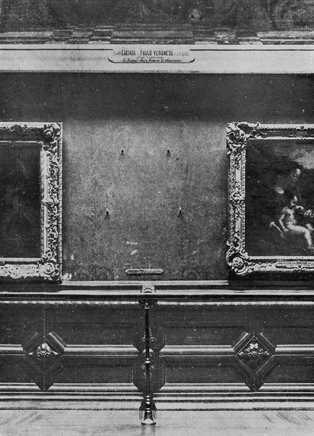The Mona Lisa's vacant place on the wall of the Salon Carré at the Louvre, photographed in August 1911 after the theft, with Veronese, Titian and Correggio still hanging around the gap