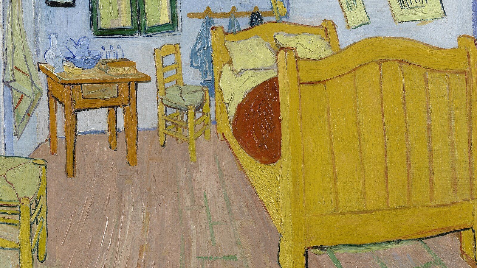 Detail of Vincent van Gogh's The Bedroom, 1888, showing the yellow bedstead, wooden chairs and pale blue walls that were originally painted violet